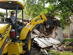 Old detached garage being removed in Minneapolis St Paul before new garage construction